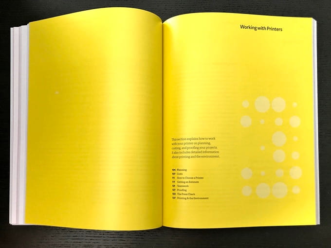 Bright yellow interior of Print book introducing a section on working with printers.